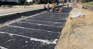 Engineered sub-ballast mats for ballast preservation and ...