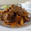 In wok or large skillet, covered, simmer spare ribs in soy sauce, garlic, ginger, star anise and enough water to barely cover. 1