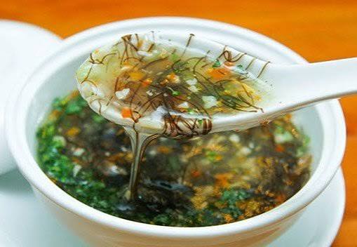 Seafood soup with black moss