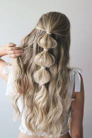 Easy bubble braid using only clear elastic bands. Picture Of An Easy Half Updo With A Bubble Braid And Waves Is A Romantic And Boho Option To Go For