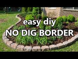 1 inch on two inch push the edging as close into the stone as you can and drive your 10 inch spike through the hole of. Easy Diy No Dig Border Youtube