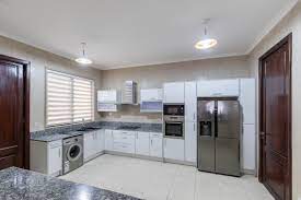 We build prefabricated kitchen cabinets to suit your needs and space with already made doors from outside the country call and talk to us. Genesis Kitchens Ltd Accra Ghana Contact Phone Address