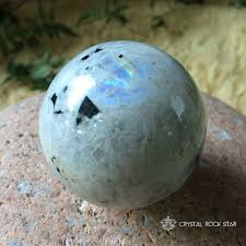 Rainbow Moonstone Sphere With Specks Of Green Tourmaline And Black Tourmaline Reiki Charged Intuition And Travel Protection Rainbow Moonstone Energy Crystals Crystal Healer