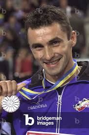 Image of PATRICK STEVENS OF BELGIUM DISPLAYS HIS SILVER MEDAL AFTER THE