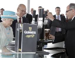 Prince Philip gazes longingly at pint ...