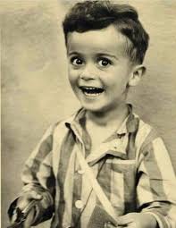 This is little Istvan Reiner aged 3-4 years old. This photograph was taken  shortly after arriving at Auschwitz concentration camp. Istvan was given a  prisoner's uniform, ordered to put it