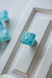 Adding the coppery rust to pretty turquoise kitchen cabinets is a unique treatment that wraps together textured tiles, oak flooring, pale surfaces and silvery appliances. 73 Turquoise Kitchens Ideas Turquoise Kitchen Kitchen Design Home Kitchens