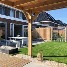 nieuwbouw tuin strak en gezellig overkapping tuin schutting tuin tuinontwerp