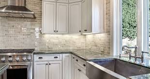 Luckily, he was a bright boy! Dark Wood Floor White Cabinets Neutral Subway Tile Farmhouse Sink