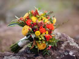 For an authentic autumn wedding bouquet orange, gold, yellow, and burgundy colored flowers are popular fall bridal bouquet choices. 15 Fall Wedding Bouquets