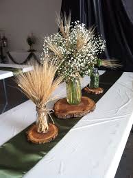 The right wedding decorations mean the difference between a rustic wedding and a luxury hotel wedding. Hops And Barley Centerpiece By Exquisite Events Bismarck Nd Rehearsal Dinner Decorations Wheat Decorations Wheat Wedding