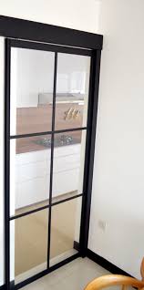 Our glass kitchen doors are made out of 100% real glass, bonded to coloured board with the option to choose dark or aluminium style boards. Black Powder Coated Aluminium Frame Kitchen Sliding Door Kitchen Sliding Doors Aluminium Sliding Doors Black Interior Doors