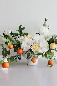 Get creative and mix white fake flowers with cream artificial flowers, add a dash of artificial greenery, and sprinkle in white roses or white hydrangeas for an everlasting and elegant look. Diy Faux Flower Wedding Centerpiece Recipe Pretty Wedding Centerpieces Wedding Centerpieces Wedding Flower Design