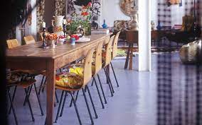 The rounded edges of the dining chairs, table, pendant, and planter work together to soften the angular shape of the windows and room itself. 10 Of The Best Dining Chairs