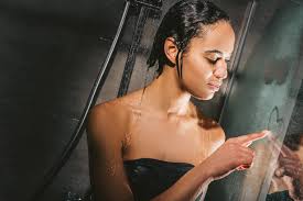 Being comfortable with yourself will draw other people to you. Attractive African American Woman Taking Shower And Drawing Heart Sign On Glass Free Stock Photo And Image
