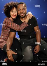 In this Tuesday, Oct. 11, 2011 photo, Tracee Ellis Ross, left, and Malcolm-Jamal  Warner, who portray a married couple in the new BET TV comedy series, Reed  Between the Lines, pose for