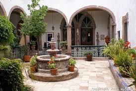 Decorating Ideas For Internal Courtyard Terracotta Tiles Central Fountain Stone Arches With White Washe Spanish Style Homes Spanish Style Colonial Exterior