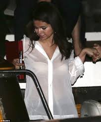 Selena Gomez reveals her bra in see-through top as she hits the ...