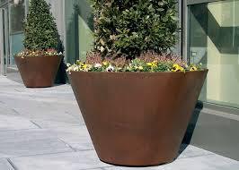 This modern steel planter features a rusted patina finish and a sleek wide design. Large Traditional Corten Steel Round Planter Various Sizes Colors Available