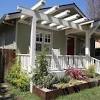This lovely victorian home in brick has two entrances, each with its own porch. 1