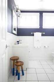White And Navy Blue Boy Bathroom With White Beadboard Trim Cottage Bathroom White Bathroom Blue Bathroom Tile Beadboard Bathroom