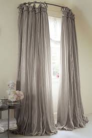 The lightweight textured fabric lets in filtered sunlight and drapes. Dramatic Windows With Draped Curtains Homebnc