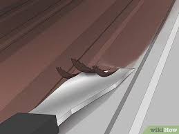 Dip a bristle brush in the mixture. How To Paint A Metal Roof With Pictures Wikihow