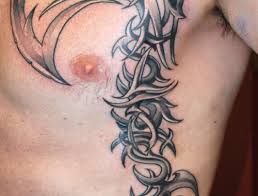 Half polynesian sleeve black ink tribal mens traditional ribs tattoos bull tribal mens rib tattoo 25 Overwhelming Rib Tattoos For Guys Creativefan