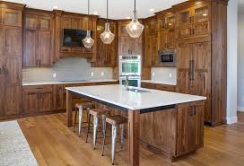 This can be one of on that note, red/brown shaded stains like walnut and chestnut have a very warming, homey effect you can see an example of a stained hardwood floor with white cabinets we did for the waterson. Rustic Walnut Cabinetry Rustic Kitchen Salt Lake City By Crown Cabinets Houzz