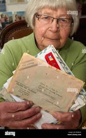 Helma Schmidt holds up letters that she and her husband wrote to Jorge M.  Bergoglio, today Pope Francis, in her home in Boppard, Germany, 21 March  2013. Bergoglio attended a two-month German