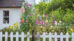 An english cottage garden has a distinct style—an informal design, densely planted, with paths and hard structures constructed from traditional building materials. Cottage Garden Plants The Top Flowers And Shrubs To Grow Country