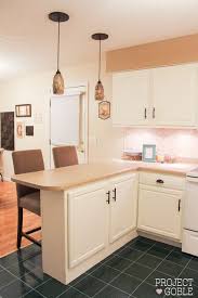 Kitchen Transformation White Cabinets Painted Counters With White Appliances Project Goble Kitchen Cabinets Kitchen Transformation Kitchen Cupboards Paint