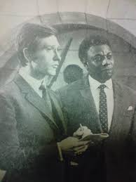 Joel Fabiani As Stewart Sullivan With Dennis Alaba Peters As Sir Curtis Seretse In Department S Painting Tribute Greatful