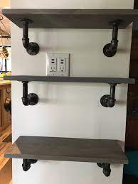 Honestly, i really like the way iron plumbing pipes look when combined with wood for all kinds of furniture projects! Simple Pipe Wall Shelf Rustic Industrial Pipe Shelf Etsy