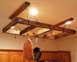 Hidden pullout wooden pot and pan hanger + free plans!!! 25 Diy Hanging Pot Rack Ideas That Prevent Kitchen Clutter Remodel Or Move