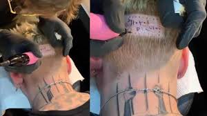 Machine gun kelly surprised fans as he debuted a freshly shaved head on his instagram, one day after getting matching tattoos with travis barker. Machine Gun Kelly Reveals Hotel Diablo Release Date With Head Tattoo