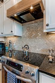 Shop tilebar for arabesque tile in marble glass and ceramic materials. Arabesque Tile Kitchen Backsplash And Wooden Range Hood Hgtv