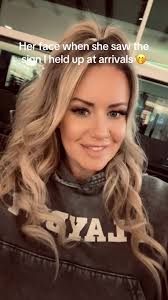 Heartwarming Arrival: A Daughter's Surprise Sign