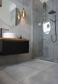 Concrete Looking Matte Grey Tiles Cover The Whole Bathroom And Make It Modern And Refined Grey Bathroom Tiles Concrete Tiles Bathroom Trendy Bathroom