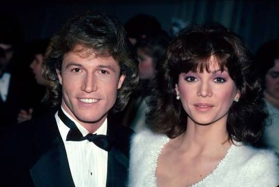 Andy Gibb and Victoria Principal attending the 9th Annual American Music Awards at Shrine Auditorium in Los Angeles on January 25, 1982. #andygibb # victoriaprincipal #1982 #80s