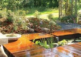 The realistic stone pool is surrounded by moss and features a realistic water color and a small turtle poking its head out of the water. Backyard Ponds 10 Stunning Water Feature Designs Bob Vila