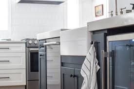 A kitchen island can add value and character to your home. White Kitchen With Blue Island And White Farm Sink Lovely Lucky Life