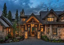 The rustic quality of this door looks nice with the stone exterior walls of the house. Farmhouse Style Home Offers Cozy Comfort In California S High Sierra