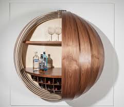 Now that you have loved the bar table and home bar furniture, check out some amazing furniture items that you can get to complement your living room furniture. A Wall Mounted Bar Cabinet Inspired By A Spinning Coin