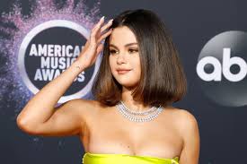 Selena's love yourself first tattoo is about making yourself a priority and your happiness a priority; Selena Gomez Tattoos