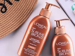 Then, slip the mitt on top of the brush head and wrap the hair tie around the handle to keep the mitt from sliding off. L Oreal Paris Sublime Bronze Self Tanning Lotion Review With Photos