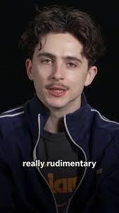 Meet the musician who taught Timothée Chalamet to play guitar like Bob  Dylan