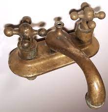 Traditional cross handles add the finishing touch. Antique Brass Bathroom Faucet Bathroom Faucets Vintage Bathroom Sink Faucet Antique Brass Faucet