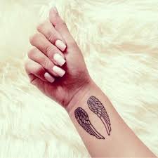Angel wings represent freedom, morality, and goodness. Tattoo Angel Wings On Wrist Tattoo Design