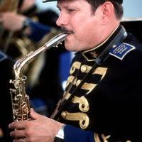 MU1 Scott Silbert of the US Navy Band in Washington, D.C. warms up his  saxophone prior to forming up with the rest of the band for the Inaugural  parade